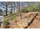 Landscaped front yard features stone steps with a railing at 220 Riverview Trl, Roswell, GA 30075
