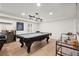 Spacious game room featuring a pool table, bar area, and modern lighting at 220 Riverview Trl, Roswell, GA 30075