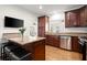 Spacious kitchen with stainless steel appliances, granite countertops, and a breakfast bar for casual dining at 220 Riverview Trl, Roswell, GA 30075