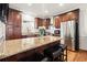 Gourmet kitchen with stainless steel appliances, granite countertops, and a large island with seating at 220 Riverview Trl, Roswell, GA 30075