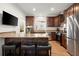 Well-appointed kitchen with granite countertops, stainless steel appliances, and an island with barstool seating at 220 Riverview Trl, Roswell, GA 30075