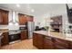 Modern kitchen featuring stainless steel appliances, granite countertops, and a convenient island for meal prep at 220 Riverview Trl, Roswell, GA 30075