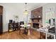 Cozy living area with a fireplace, hardwood floors, and stylish decor for comfortable living and entertaining at 220 Riverview Trl, Roswell, GA 30075