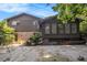 Image shows the back of a house with a yard, swing set, and partially shaded patio at 2209 Willoby Ct, Morrow, GA 30260
