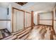 Basement interior featuring decorative flooring, storage closets, and an exposed ceiling at 2209 Willoby Ct, Morrow, GA 30260