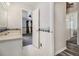 Bathroom with white tiling, fixtures, and a view into the Primary bedroom at 2209 Willoby Ct, Morrow, GA 30260