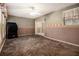 A large carpeted bedroom featuring a ceiling fan and access to an outdoor patio space at 2209 Willoby Ct, Morrow, GA 30260