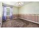 Bedroom with a window bringing in natural light and patterned wall decor at 2209 Willoby Ct, Morrow, GA 30260