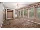 Bedroom features natural light with windows, a ceiling fan, and closet with shelving at 2209 Willoby Ct, Morrow, GA 30260