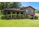 Inviting home featuring brick archways and mature landscaping surrounding the front entrance at 2209 Willoby Ct, Morrow, GA 30260
