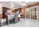 Bright eat-in kitchen featuring white tile, classic cabinets, and access to outdoor space at 2209 Willoby Ct, Morrow, GA 30260