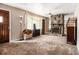 Spacious living room with a unique stone fireplace and ample natural light from a large window at 2209 Willoby Ct, Morrow, GA 30260