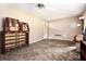 Versatile room with neutral carpet, perfect as a bedroom or living space, awaiting your decor at 2209 Willoby Ct, Morrow, GA 30260