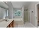 This bathroom includes a vanity, tub, shower and large window at 2477 Lakebrooke Dr, Marietta, GA 30066