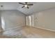 This bedroom offers neutral walls, carpet flooring and a ceiling fan at 2477 Lakebrooke Dr, Marietta, GA 30066