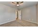 This bedroom features a ceiling fan and two doors, one leading to another room at 2477 Lakebrooke Dr, Marietta, GA 30066