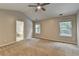 This bedroom offers neutral walls, carpet flooring and two windows at 2477 Lakebrooke Dr, Marietta, GA 30066