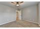 This bedroom features a ceiling fan and two doors, one leading to another room at 2477 Lakebrooke Dr, Marietta, GA 30066