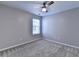 Bedroom with carpet, a window with blinds, and a modern ceiling fan at 2477 Lakebrooke Dr, Marietta, GA 30066