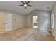 This bedroom includes carpet flooring, ceiling fan and neutral walls at 2477 Lakebrooke Dr, Marietta, GA 30066