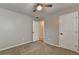 Bedroom showcasing a ceiling fan and two doors, one opening into another room at 2477 Lakebrooke Dr, Marietta, GA 30066