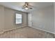 Bedroom with a neutral carpet, paint, and a ceiling fan at 2477 Lakebrooke Dr, Marietta, GA 30066