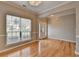 Elegant foyer with hardwood floors, decorative trim, and a stylish light fixture at 2477 Lakebrooke Dr, Marietta, GA 30066