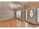 Elegant foyer with hardwood floors, decorative trim, and a stylish light fixture at 2477 Lakebrooke Dr, Marietta, GA 30066