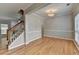 Elegant foyer with hardwood floors, decorative trim, and a staircase at 2477 Lakebrooke Dr, Marietta, GA 30066