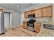 Kitchen featuring stainless steel appliances, granite counters and hardwood flooring at 2477 Lakebrooke Dr, Marietta, GA 30066