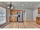 Kitchen/Dining space featuring stainless steel appliances, granite counters, hardwood flooring and natural light at 2477 Lakebrooke Dr, Marietta, GA 30066