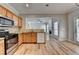 Bright kitchen featuring stainless steel appliances, granite counters, hardwood flooring and recessed lighting at 2477 Lakebrooke Dr, Marietta, GA 30066