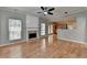 Spacious living room with fireplace and an open layout into the kitchen at 2477 Lakebrooke Dr, Marietta, GA 30066