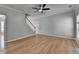 Spacious living room with hardwood floors, staircase, and bright windows at 2477 Lakebrooke Dr, Marietta, GA 30066