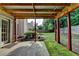 Covered back patio right off the main house with access to the fenced yard at 2477 Lakebrooke Dr, Marietta, GA 30066