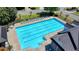 Aerial view of a large community pool surrounded by seating and well maintained grounds at 2477 Lakebrooke Dr, Marietta, GA 30066
