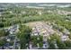 Aerial view showcases the home's location within a neighborhood with lush greenery at 440 S Alexander St, Buford, GA 30518