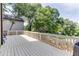 Expansive back deck offers an ideal space for outdoor entertaining or relaxing with views of the lush backyard at 440 S Alexander St, Buford, GA 30518
