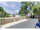 Large back deck overlooking a fenced backyard, perfect for entertaining and outdoor relaxation on sunny days at 440 S Alexander St, Buford, GA 30518