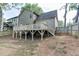 Spacious backyard with a wooden deck, offering plenty of room for outdoor activities and entertainment at 440 S Alexander St, Buford, GA 30518