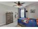 Cozy bedroom with ceiling fan, natural light, and comfortable decor creating a relaxing space at 440 S Alexander St, Buford, GA 30518