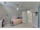 Bright bedroom featuring a ceiling fan, plush carpeting, and a whimsical personalized touch at 440 S Alexander St, Buford, GA 30518