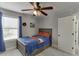 Charming bedroom with natural light, ceiling fan, and ample storage within the built in drawer system at 440 S Alexander St, Buford, GA 30518