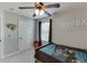 Comfortable bedroom with natural light, ceiling fan, and sports team decor creating a cozy atmosphere at 440 S Alexander St, Buford, GA 30518