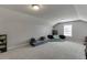 Open bonus room with neutral tones, providing a flexible area for recreation and relaxation at 440 S Alexander St, Buford, GA 30518