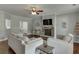 Cozy living room featuring a stone fireplace and comfortable seating at 440 S Alexander St, Buford, GA 30518