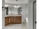 Spacious main bathroom features double sinks with dark wood cabinets and granite counters at 440 S Alexander St, Buford, GA 30518