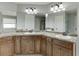 Large main bathroom features double sinks with dark wood cabinets and ample countertop space at 440 S Alexander St, Buford, GA 30518