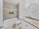 Bathroom with a tiled shower, a granite-topped vanity, and a round mirror at 1886 Akron Se Dr, Atlanta, GA 30315