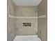 Modern bathroom features tiled shower and tub with tiled niche at 1886 Akron Se Dr, Atlanta, GA 30315